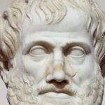 A close up of a marble bust of Aristotle.